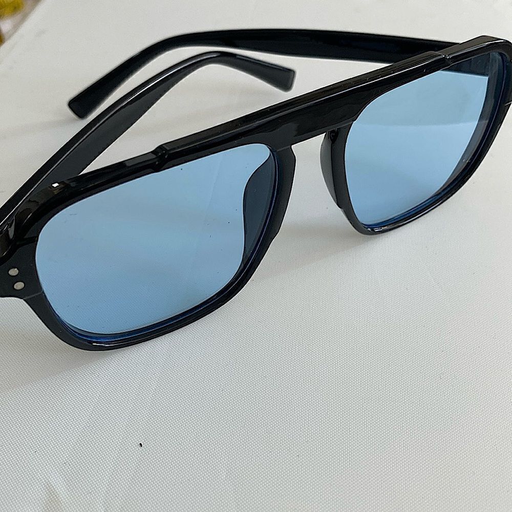 Black frame sunglasses with light blue lens one size fits all